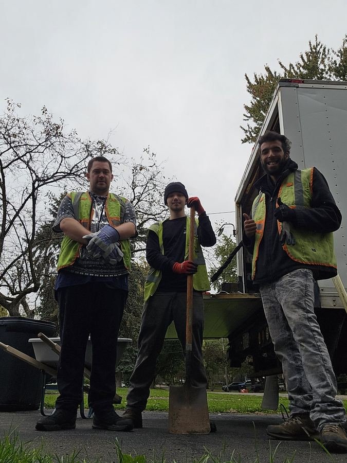 The Slims crew with their box truck, ready for junk removal and hauling